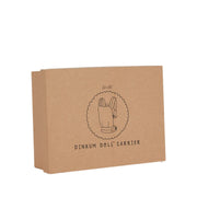 A Olli Ella Doll Carrier with padded straps designed for carrying dolls.